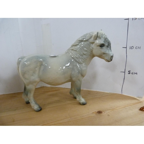 81 - Four Beswick dapple grey horses of various sizes including Arab Xayal, no. 1265.  (4)