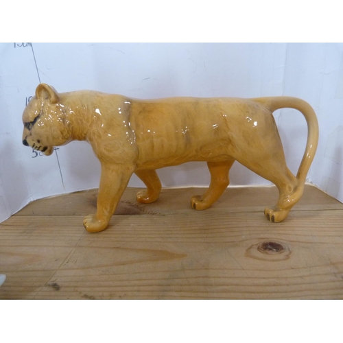 84 - Beswick figure of a leopard and another Beswick figure of a lioness.  (2)