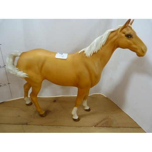 87 - Four assorted Beswick horses, glazed in tan, various sizes.  (4)