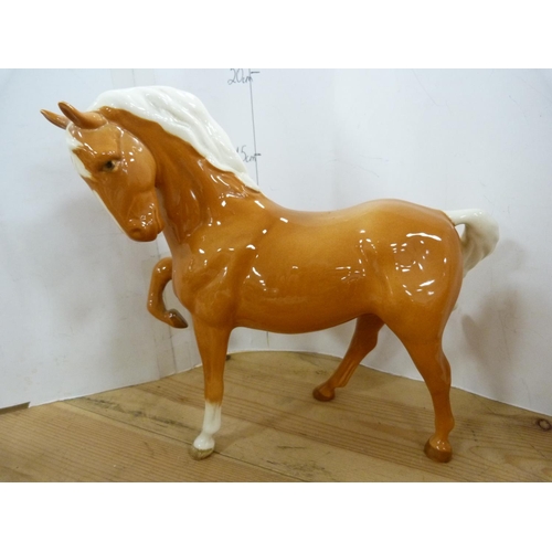 87 - Four assorted Beswick horses, glazed in tan, various sizes.  (4)