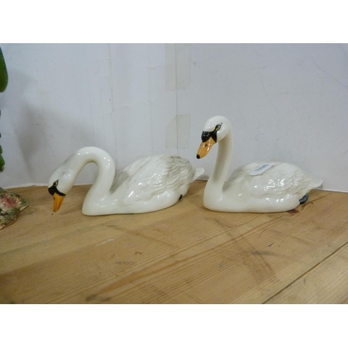 88 - Three Beswick bird figures including parrot and two others, one stamped 929 to the underside, also a... 