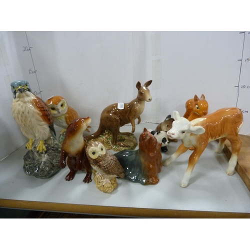 89A - Beswick figures of owls, kangaroo, otter, panda etc.