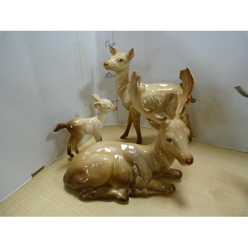 99 - Four assorted Beswick animal figures including an elephant, stag, no. 954, deer and fawn figures.  (... 