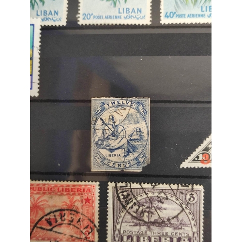 263 - World. Three postage stamp albums arranged alphabetically by country ranging from Latvia to Yugoslav... 