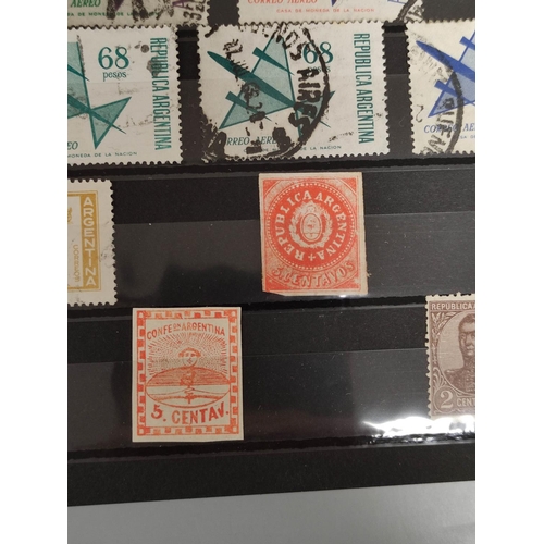 264 - World. Three postage stamp albums arranged alphabetically by country ranging from Abu Dhabi to Franc... 