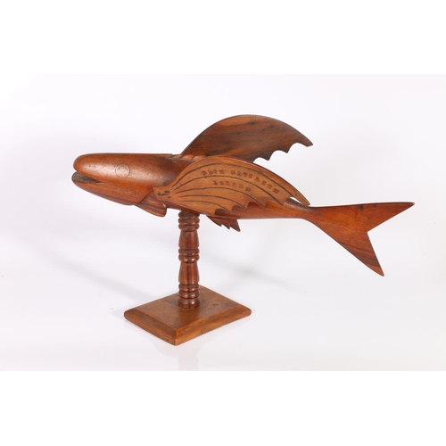 398 - Pitcairn Island carving of a flying fish by Oscar Clark, incised to the wings and impressed with the... 