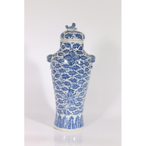 401 - 19th century Chinese blue and white baluster vase and domed cover, the body decorated with flowers o... 