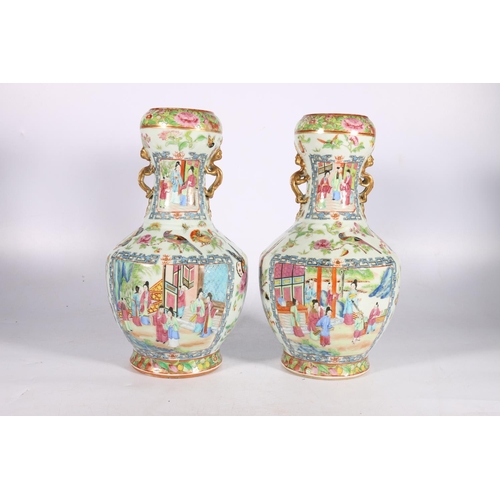 406 - Pair of 19th century Chinese Canton famille rose vases with flaring onion shaped rim and dragon hand... 