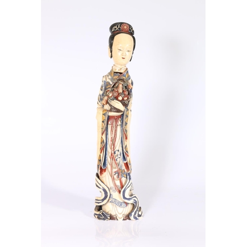 419 - Chinese early 20th century polychrome carved and painted ivory figure of Quan Yin holding a basket o... 