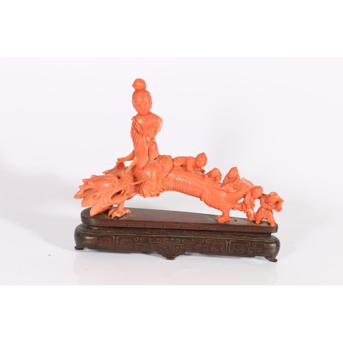 420 - Chinese late 19th century carved coral dragon, with a seated Quan Yin and five children playing on t... 