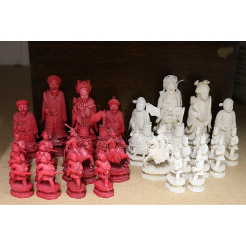 444 - Late 19th century Chinese white and red stained ivory chess set, the king 11.5cm, elephant castles a... 