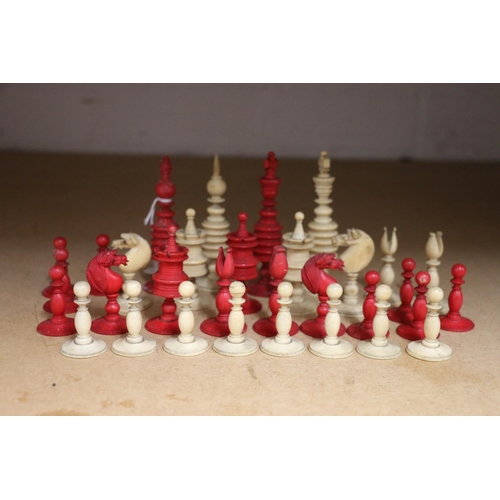 445 - 19th century English turned ivory and red stained ivory chess set, the king 10.5cm, complete 32 piec... 