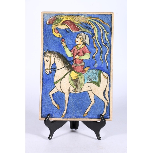 448 - 20th century painted Qajar style tile depicting a figure on horseback feeding a peach to a phoenix, ... 