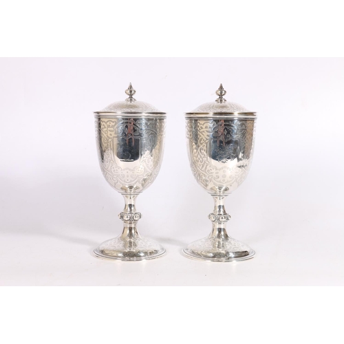 63 - Pair of Victorian silver goblet cups and covers with all-over incised decoration by Robert Hennell I... 