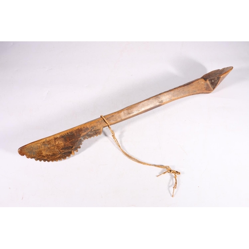 400 - Large African spoon, with shovel bowl and serrated decoration the shaped handle with incised chevron... 