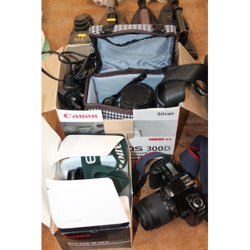 410 - Three cameras to include Canon EOS 500, Canon EOS,&nbsp; and Canon EOS 100.