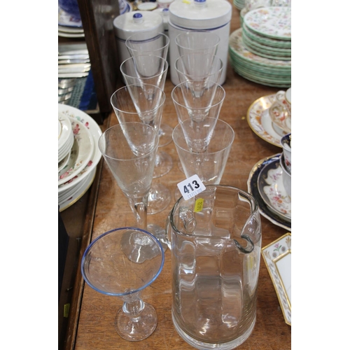 413 - Eight drinking glasses, a jug, and another glass.