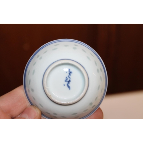 165 - Pair of Chinese dragon decorated blue and white rice bowls.