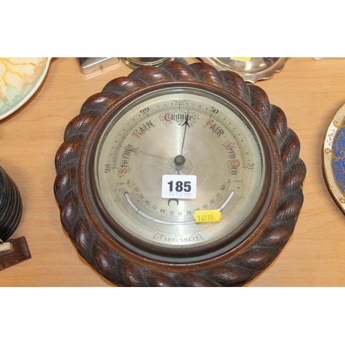 185 - Heavily carved oak barometer.