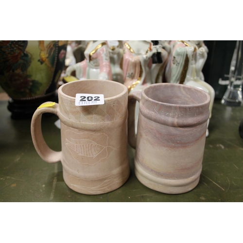 202 - Pair of hardstone mugs.