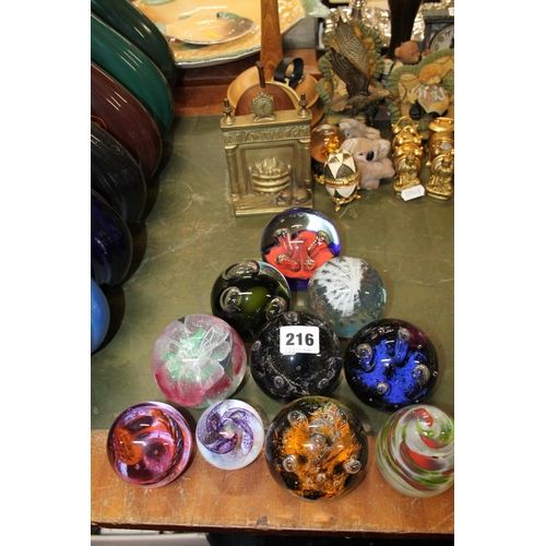 216 - Ten glass paperweights.