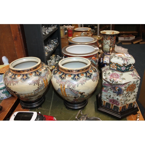 220 - Two oriental vases on hardwood stands and an oriental floral decorated ginger jar on stand.