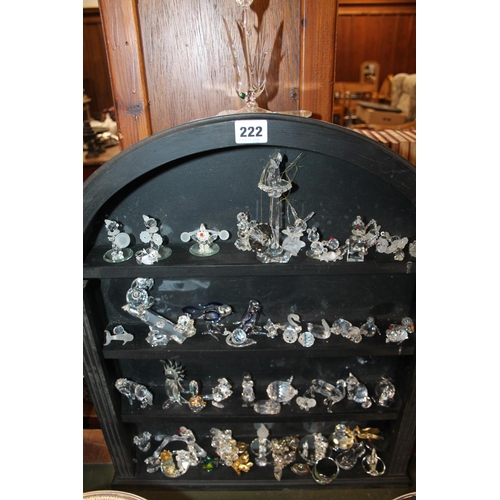 222 - Large collection of Swarovski, and other glass animal models, on stand.