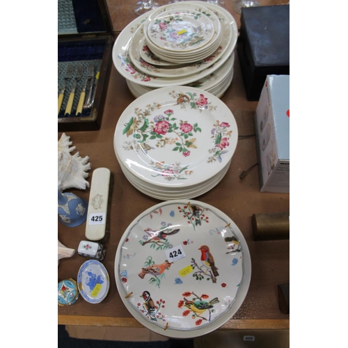 424 - Wedgwood floral decorated dinnerware, a bird decorated plate, etc.