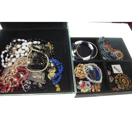 461 - Fitted modern glass case containing costume jewellery.