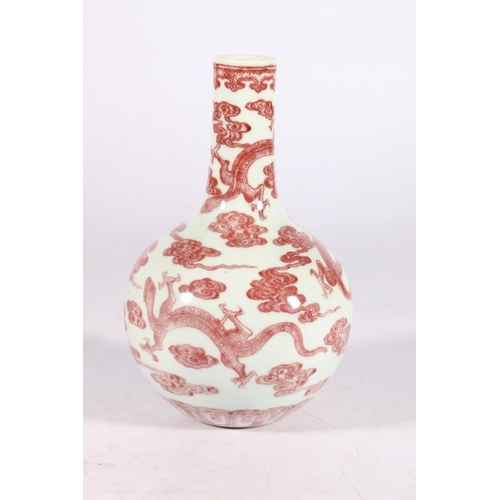 423 - 19th century Chinese underglaze red decorated bottle vase, with finely detailed multiple chi lung am... 