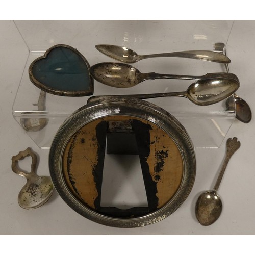 311 - Five silver frames, various spoons and other items.