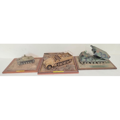 69 - Three collector's model military vehicles. To include a Panzerkampfwagen II, a Sd. KFz 9 