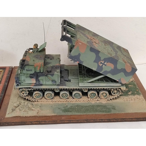 69 - Three collector's model military vehicles. To include a Panzerkampfwagen II, a Sd. KFz 9 