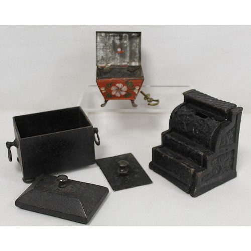 256 - Novelty cast iron money box in the form of a cash register, 11cm high; a red Toleware small trinket ... 