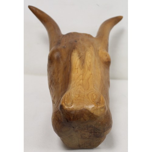 259 - Carved wooden head of an ox, sculpted from a single block of wood, incised with number XVI, 48cm lon... 