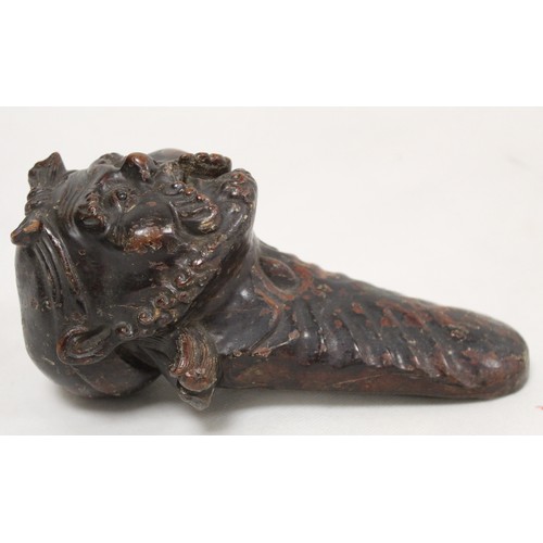 261 - Late 19th/early 20th century Oriental lacquered carved wooden wedge, possibly for use as a doorstop,... 