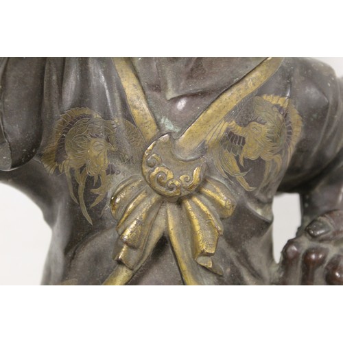 262 - Japanese Meiji Period lacquered bronze figure of an Oni standing with raised arm and clenched fist, ... 