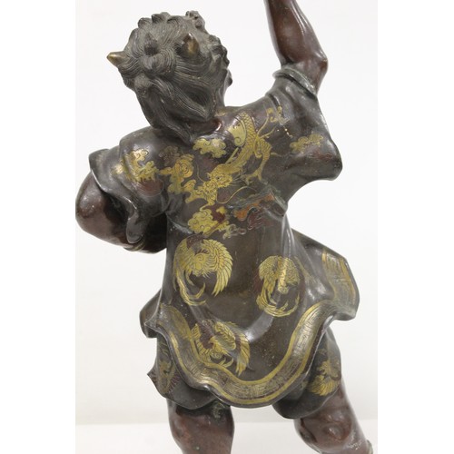 262 - Japanese Meiji Period lacquered bronze figure of an Oni standing with raised arm and clenched fist, ... 