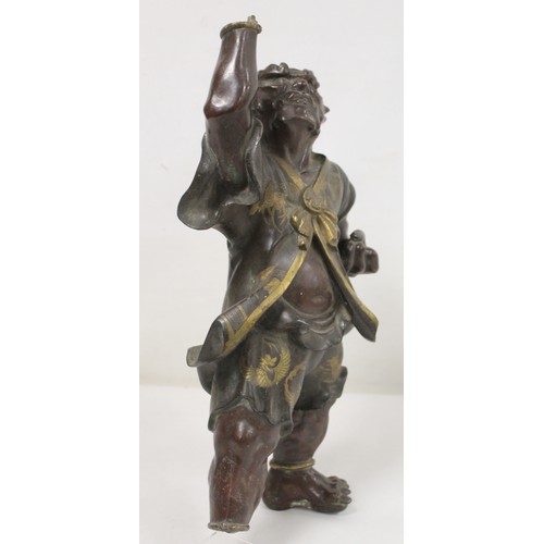 262 - Japanese Meiji Period lacquered bronze figure of an Oni standing with raised arm and clenched fist, ... 