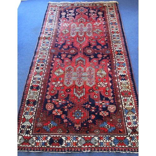 88 - 20th century Caucasian carpet in predominantly blue, red and white wools on cotton, with two geometr... 