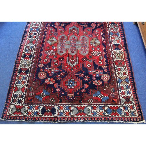 88 - 20th century Caucasian carpet in predominantly blue, red and white wools on cotton, with two geometr... 