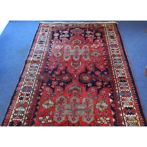 88 - 20th century Caucasian carpet in predominantly blue, red and white wools on cotton, with two geometr... 