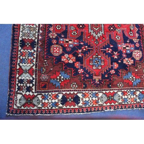 88 - 20th century Caucasian carpet in predominantly blue, red and white wools on cotton, with two geometr... 