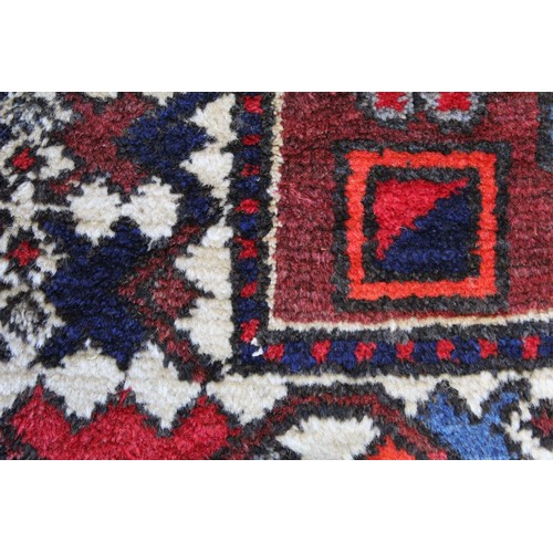 88 - 20th century Caucasian carpet in predominantly blue, red and white wools on cotton, with two geometr... 