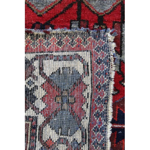 88 - 20th century Caucasian carpet in predominantly blue, red and white wools on cotton, with two geometr... 