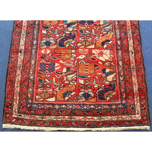 87 - Modern Caucasian Karabakh carpet or runner in wool on cotton, in reds and blues with stylised flower... 