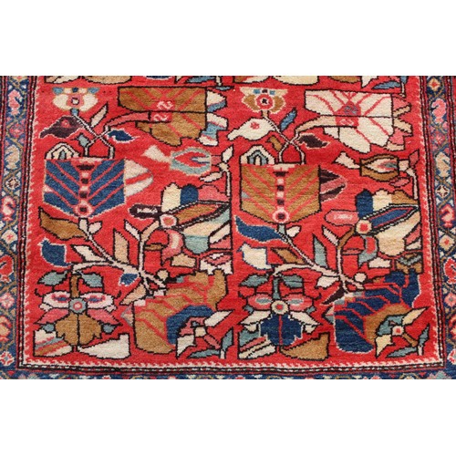 87 - Modern Caucasian Karabakh carpet or runner in wool on cotton, in reds and blues with stylised flower... 