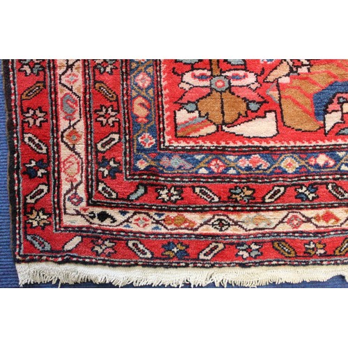 87 - Modern Caucasian Karabakh carpet or runner in wool on cotton, in reds and blues with stylised flower... 