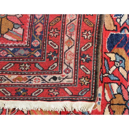 87 - Modern Caucasian Karabakh carpet or runner in wool on cotton, in reds and blues with stylised flower... 