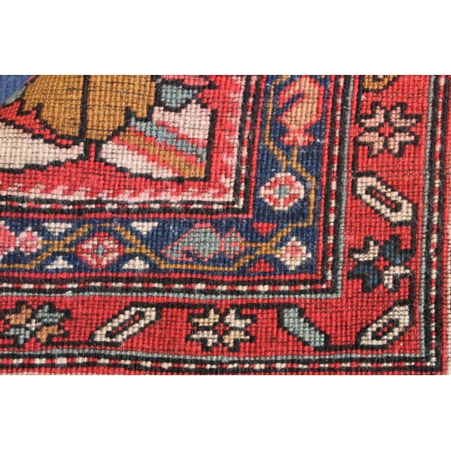 87 - Modern Caucasian Karabakh carpet or runner in wool on cotton, in reds and blues with stylised flower... 